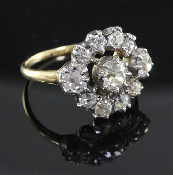 A Victorian gold, silver and diamond cluster ring, size P.